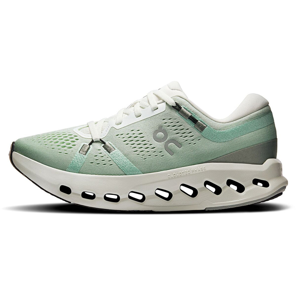 Mint green running shoe with white sole on a white background