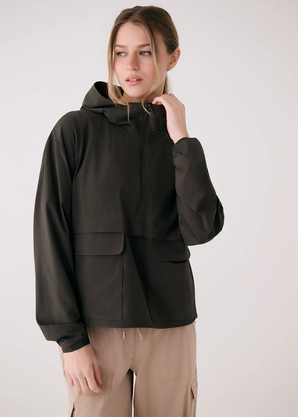 Person wearing a black jacket with a white background