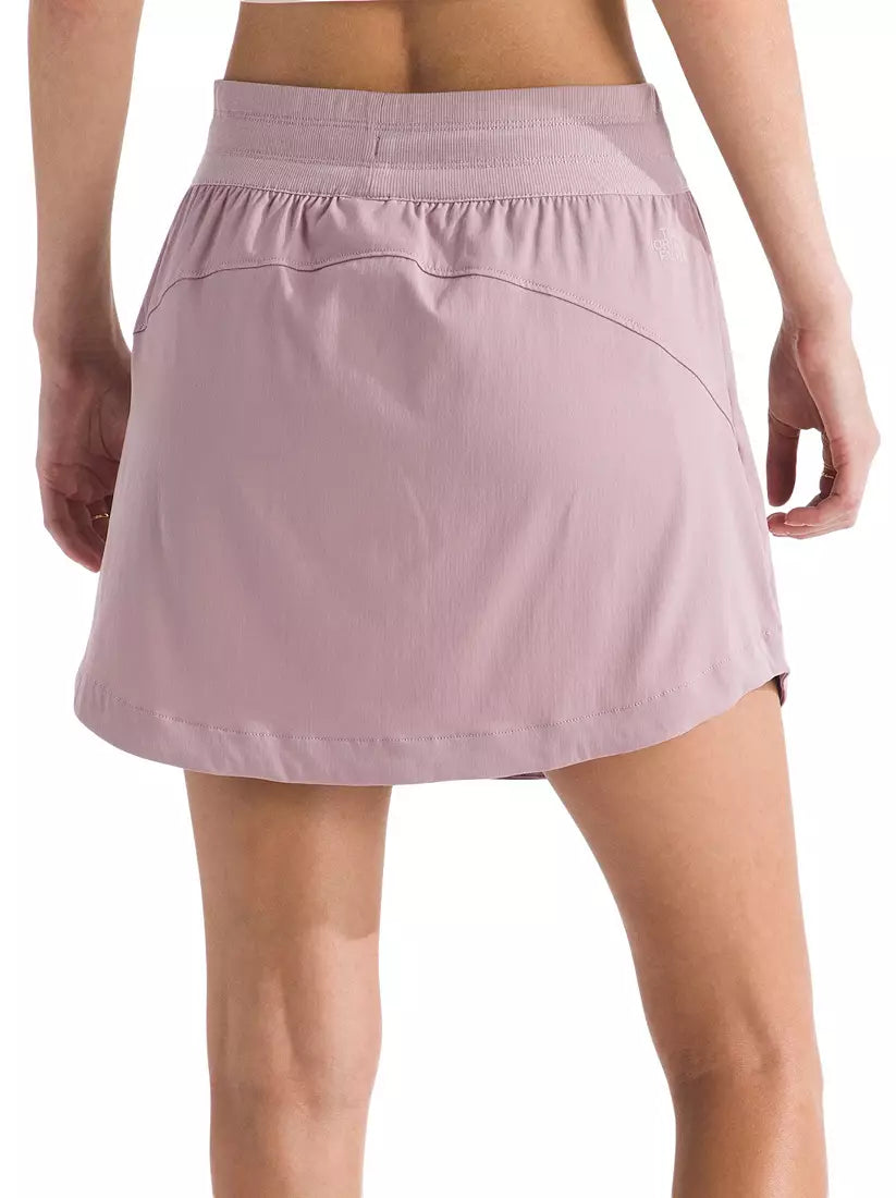 Pink skirt worn by a person on a white background