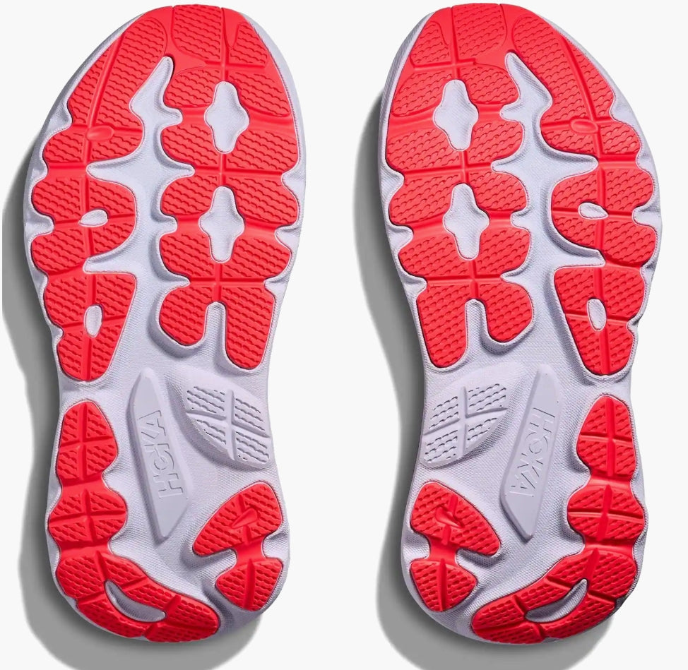 Close-up of red and gray shoe soles on a light gray background