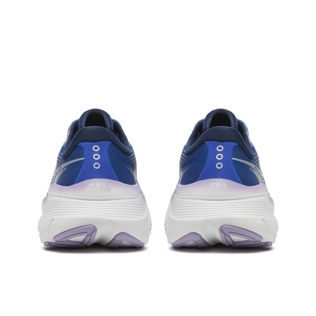 A pair of Hoka running shoes shown from the rear, featuring a navy blue upper with a vibrant blue and purple gradient heel counter, a thick white midsole, and light purple outsole accents.