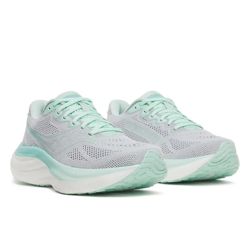 A pair of Hoka running shoes in light gray and mint green, shown from a three-quarters angle on a white background.