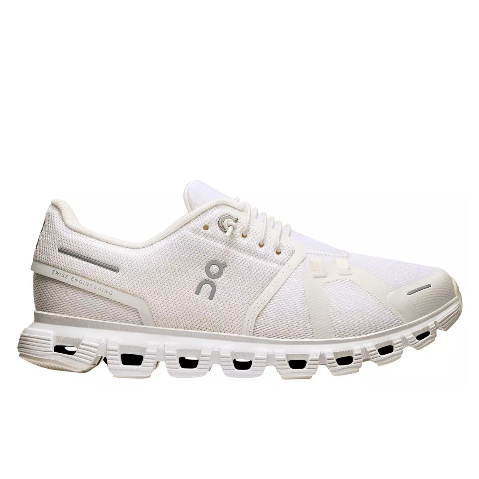 A white On running shoe with a chunky, sculpted sole featuring black air pockets, shown from a side profile on a white background.