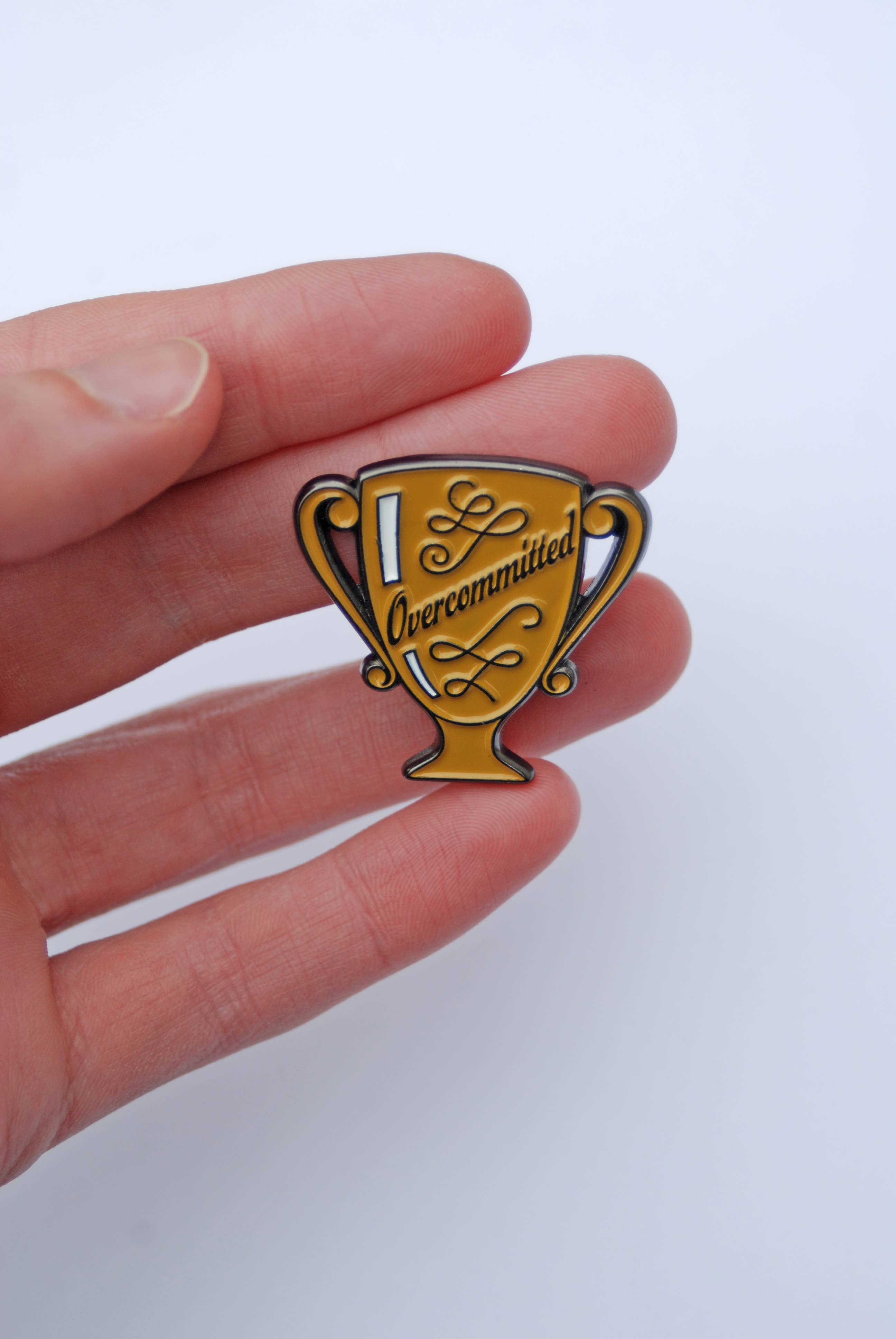 Overcommitted Trophy Enamel Pin
