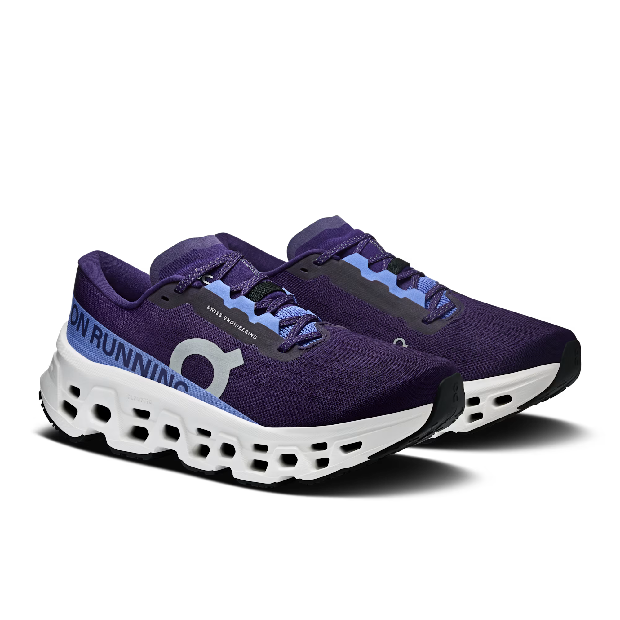 Purple running shoes with white soles on a white background