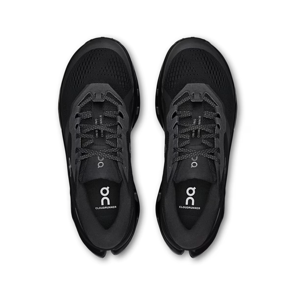 Black running shoes with 'on' branding on a transparent background