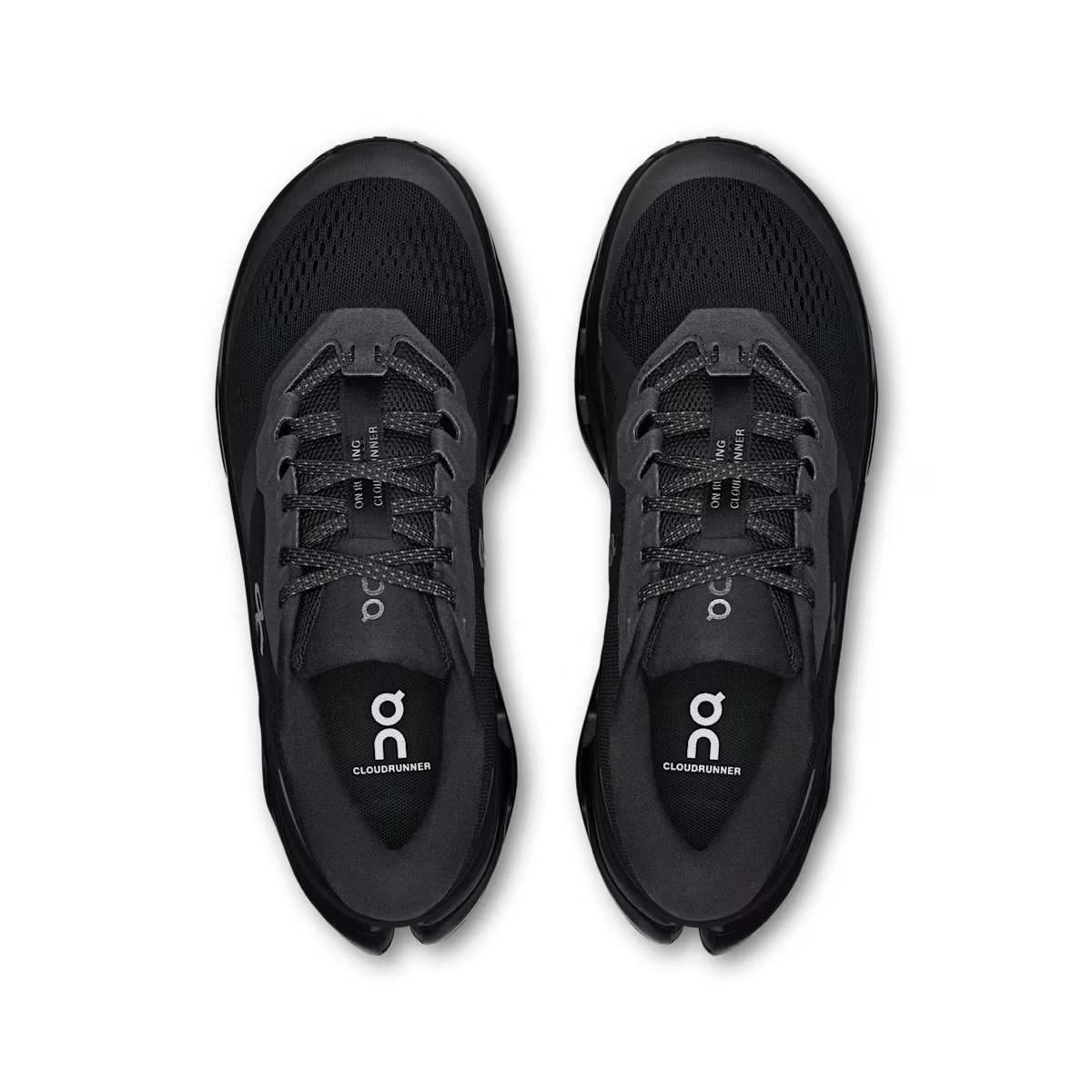 Black running shoes with 'on' branding on a transparent background