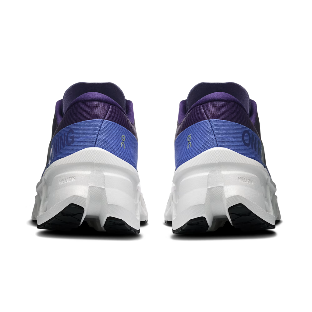 Pair of blue and purple running shoes with white soles on a transparent background