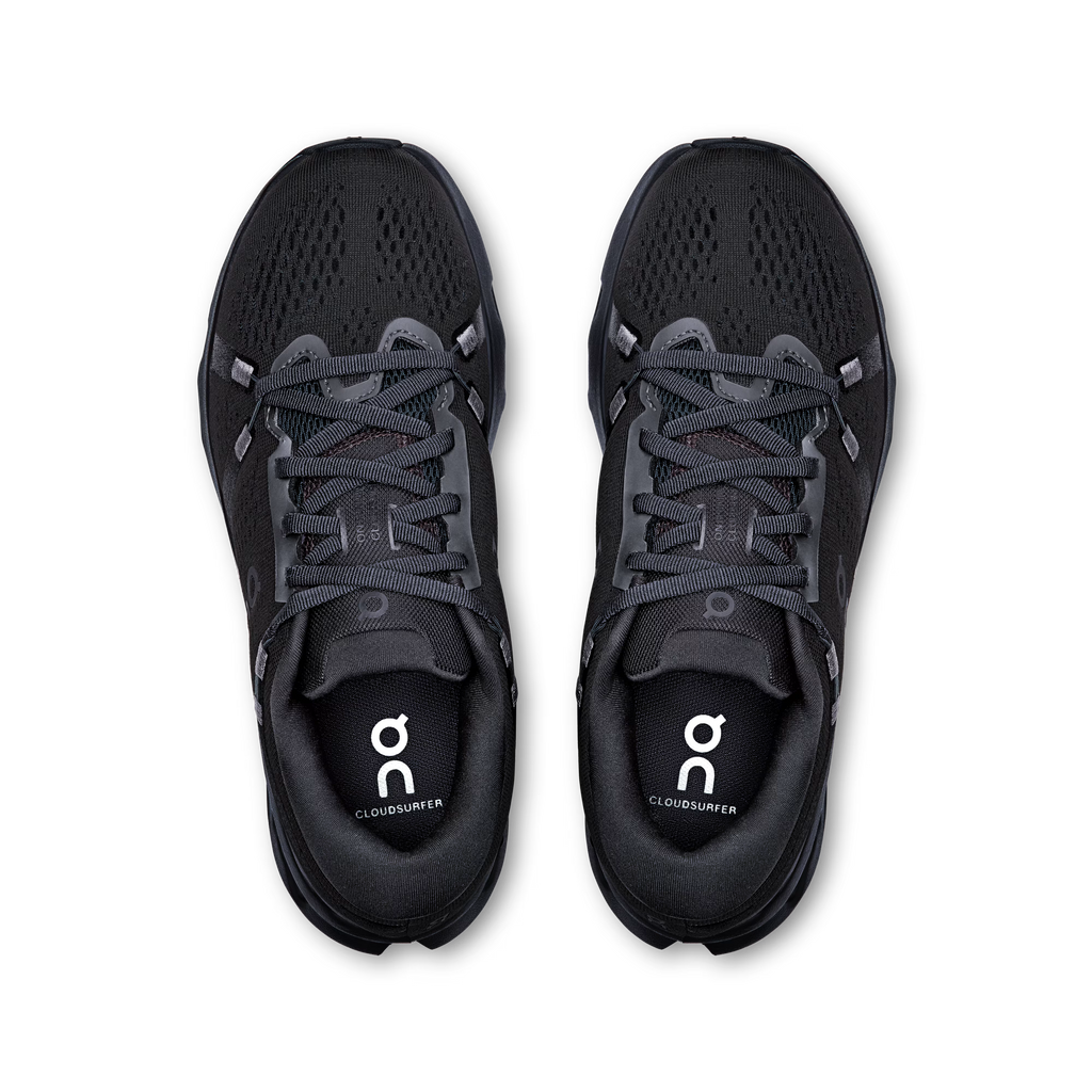 Black running shoes with laces on a white background