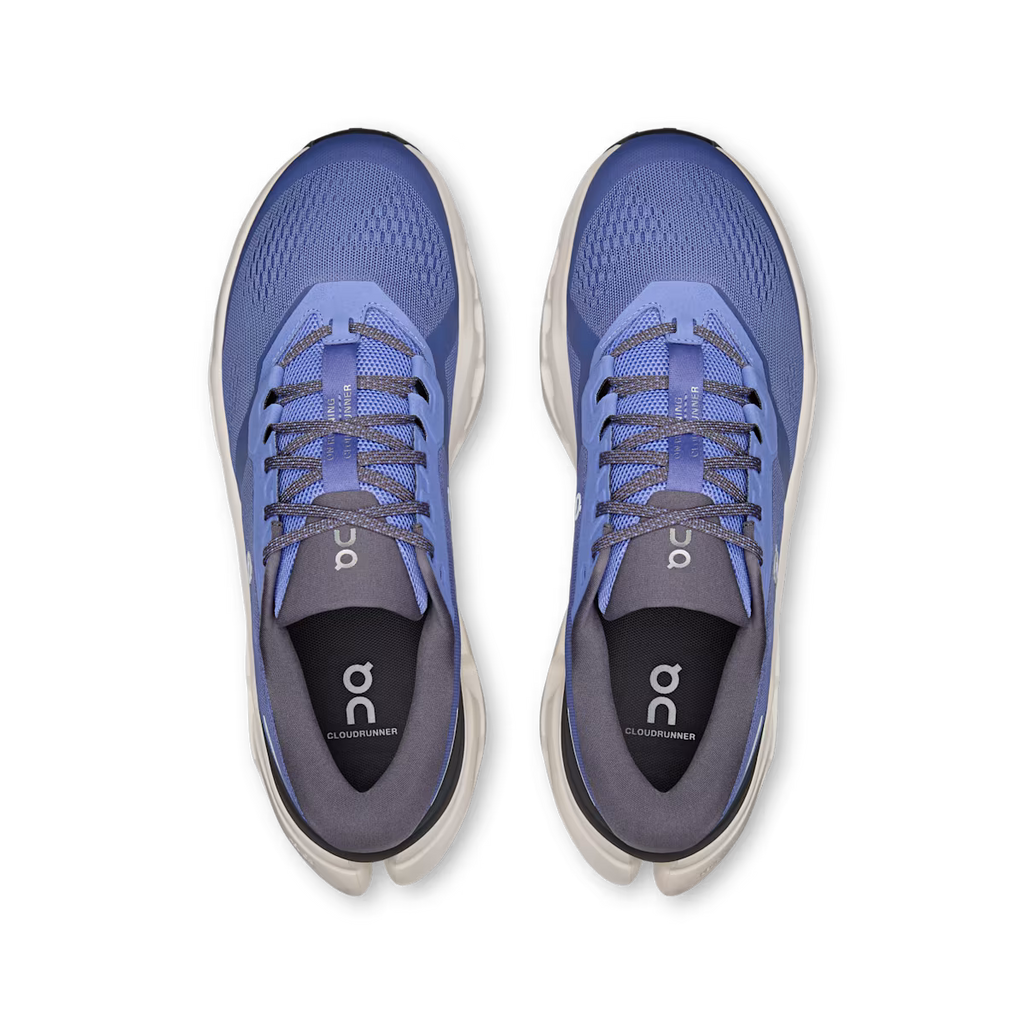 Blue running shoes with gray accents on a white background