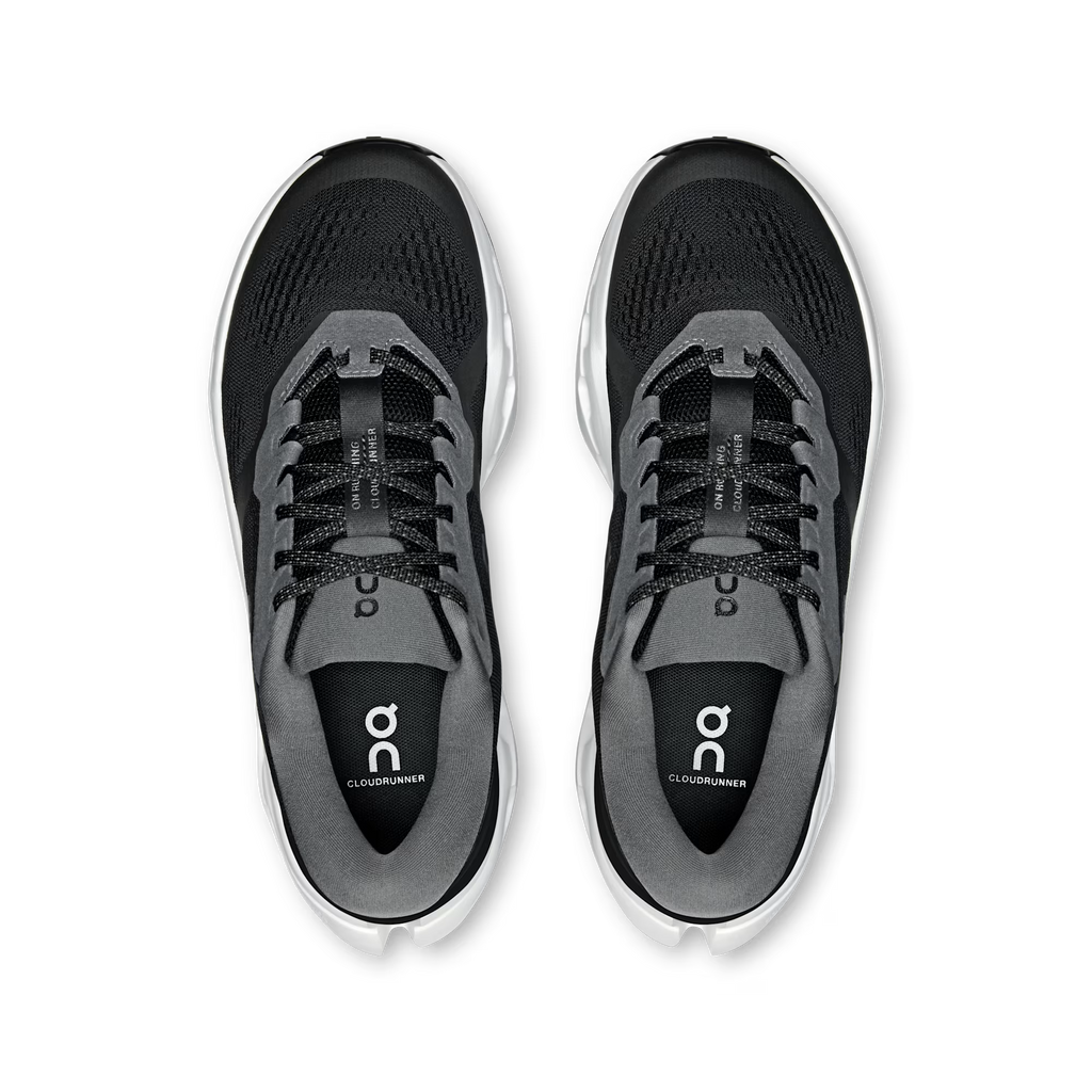 A pair of black and gray running shoes shown from a top-down view on a clean white background. The shoes feature a black mesh upper, gray synthetic overlays, black laces, and a white midsole.