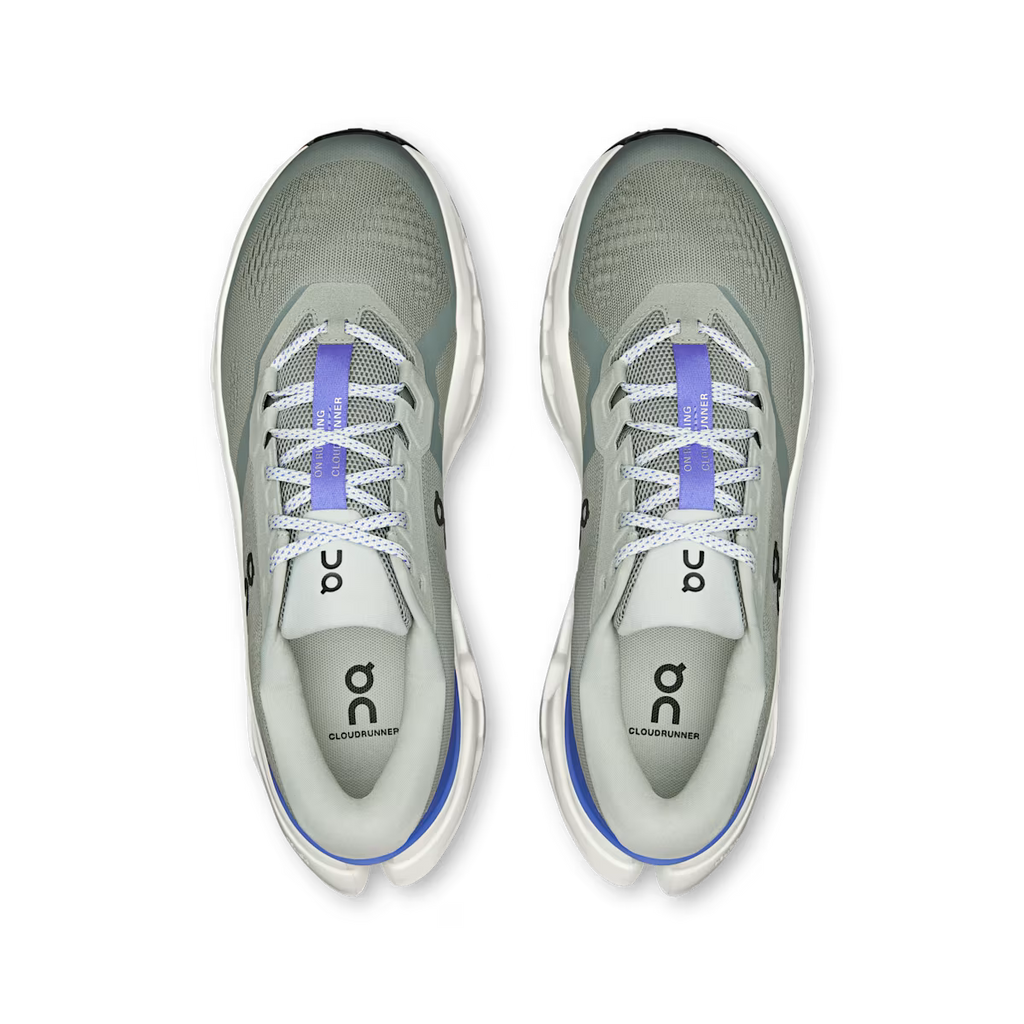 Pair of gray running shoes with white soles on a transparent background