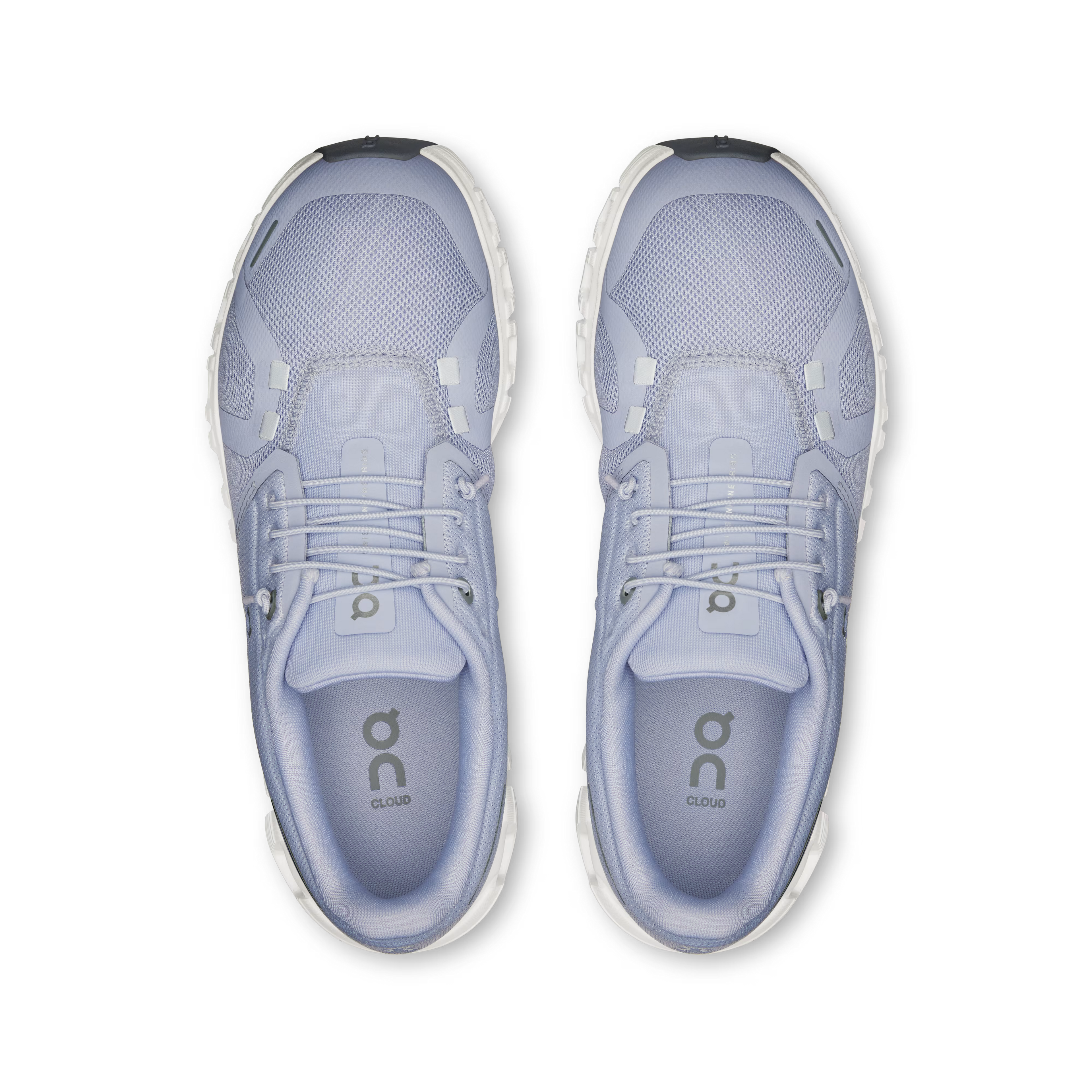 Pair of light blue running shoes with 'On' branding on a white background