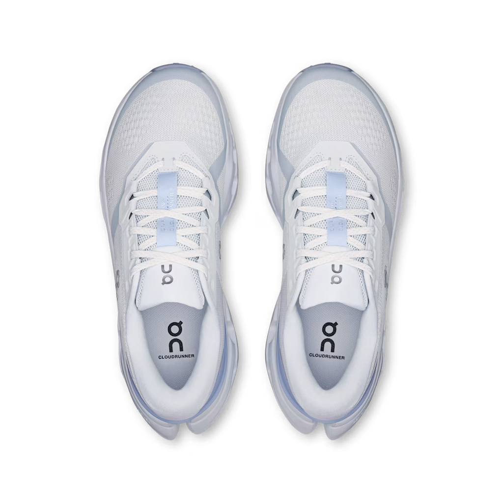 White running shoes with blue accents on a transparent background
