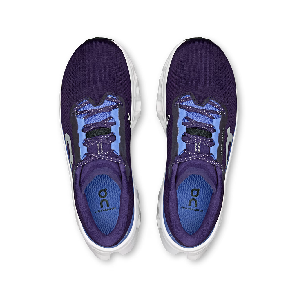 Purple running shoes with white soles on a transparent background