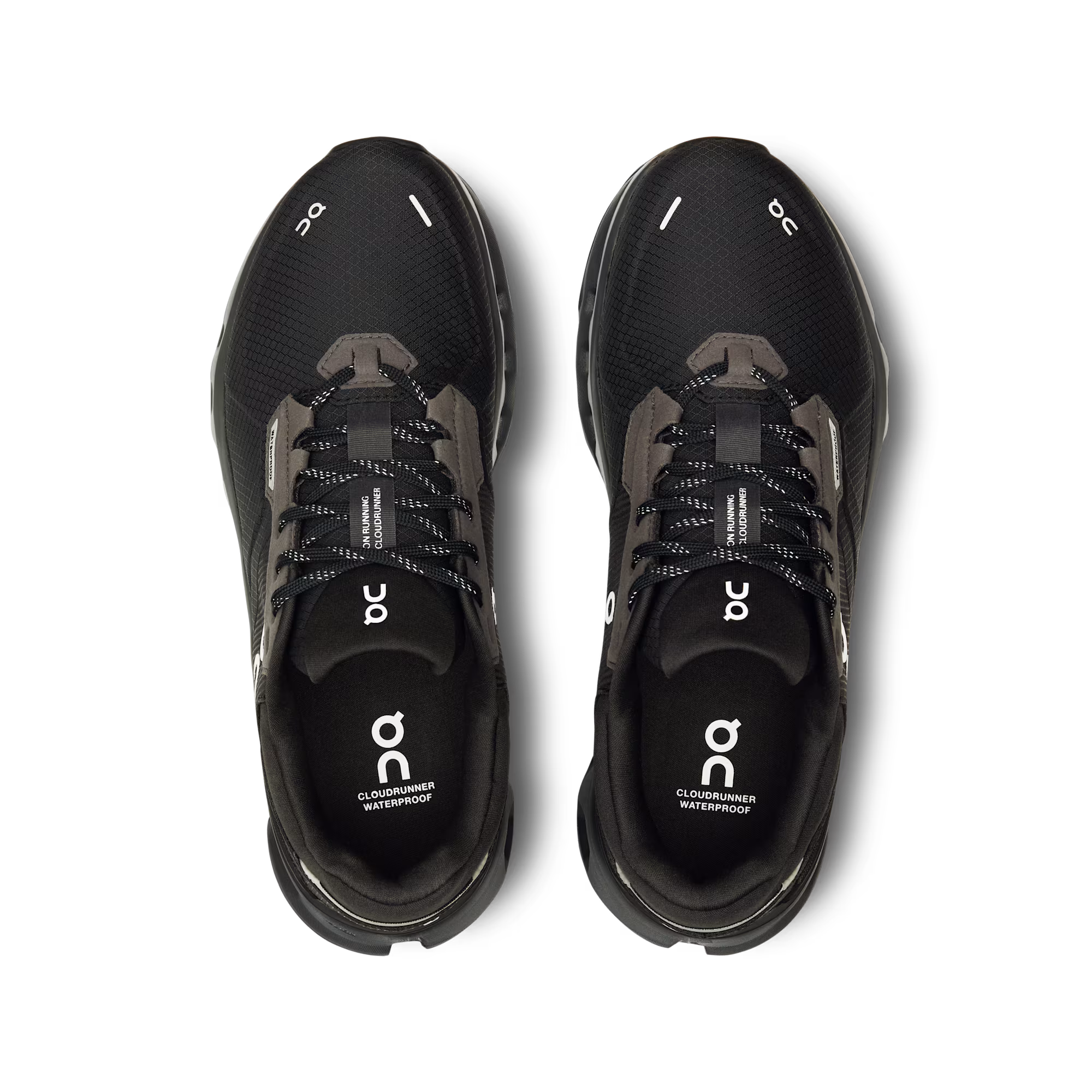 Black running shoes with 'on' branding on a white background