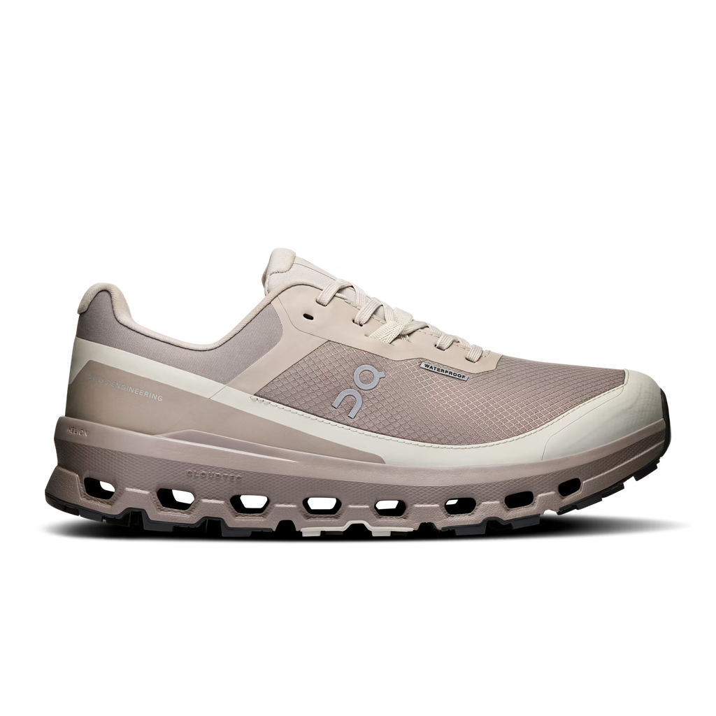 Beige running shoe with unique sole design on a white background
