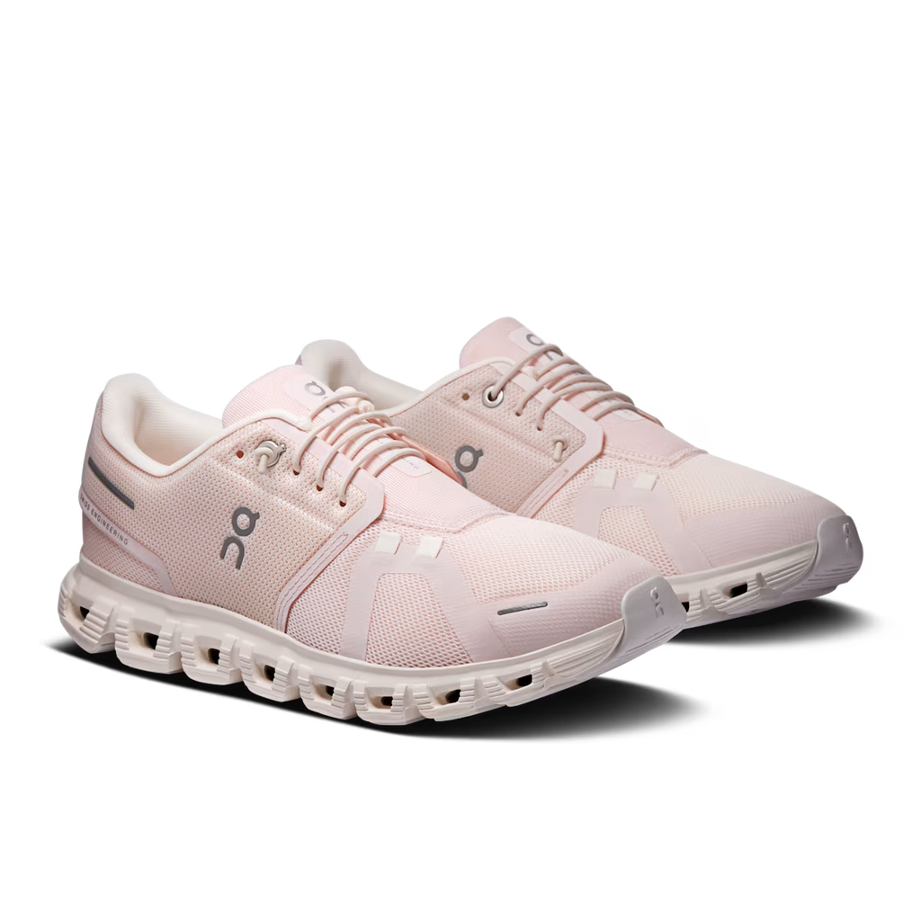 Pair of pink running shoes on a transparent background