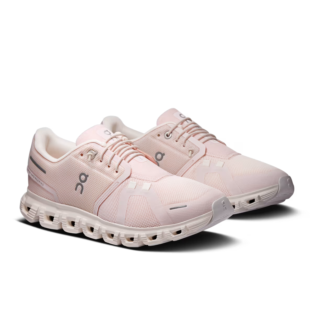 Pair of pink running shoes on a transparent background