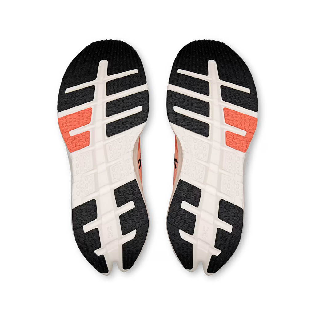Black, white, and orange sole of a shoe on a transparent background