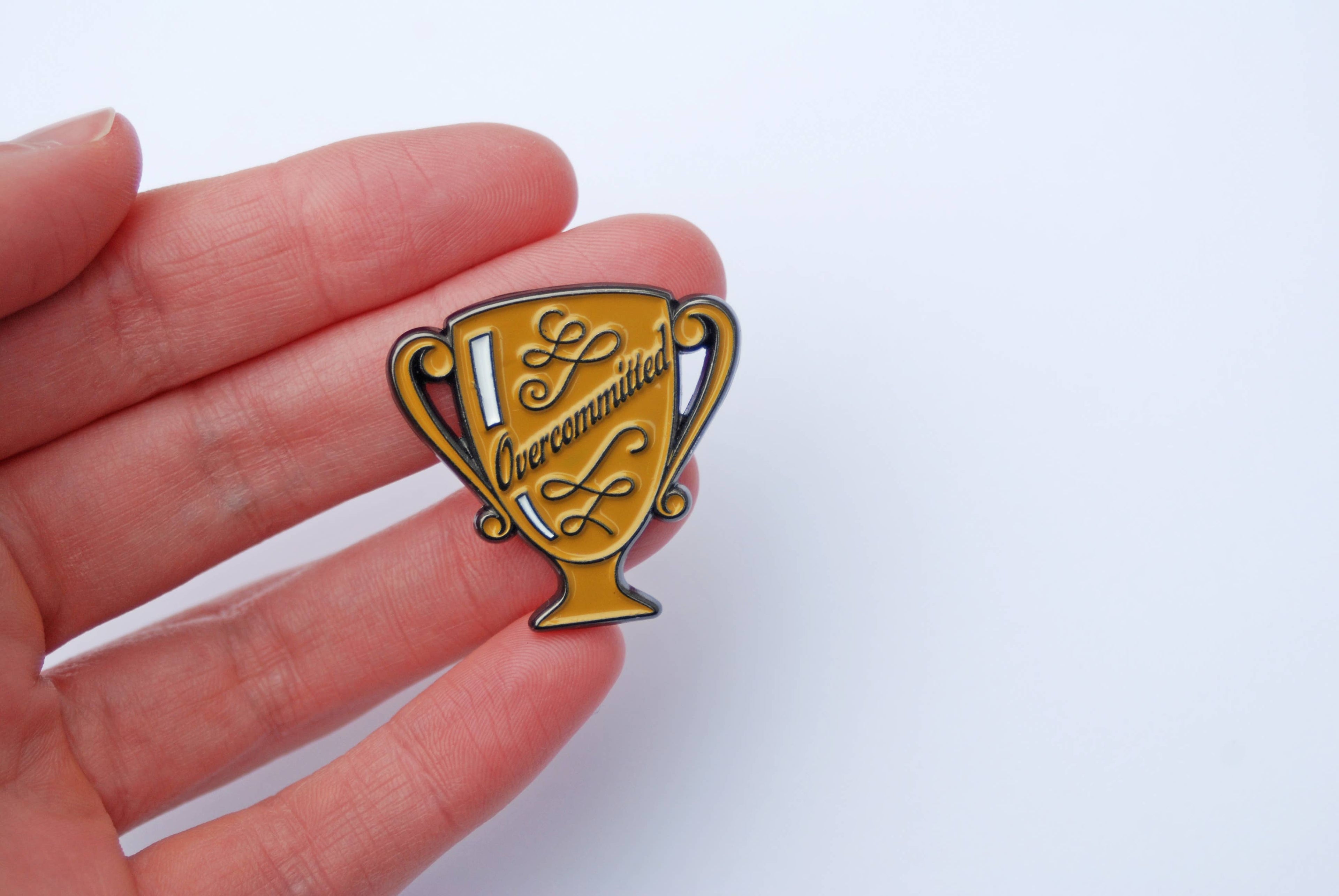 Overcommitted Trophy Enamel Pin