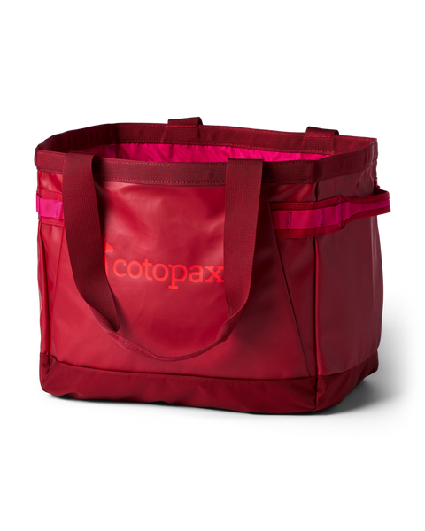 A red Cotopax insulated tote bag with a bright pink interior lining and matching pink accents, shown on a clean white background.