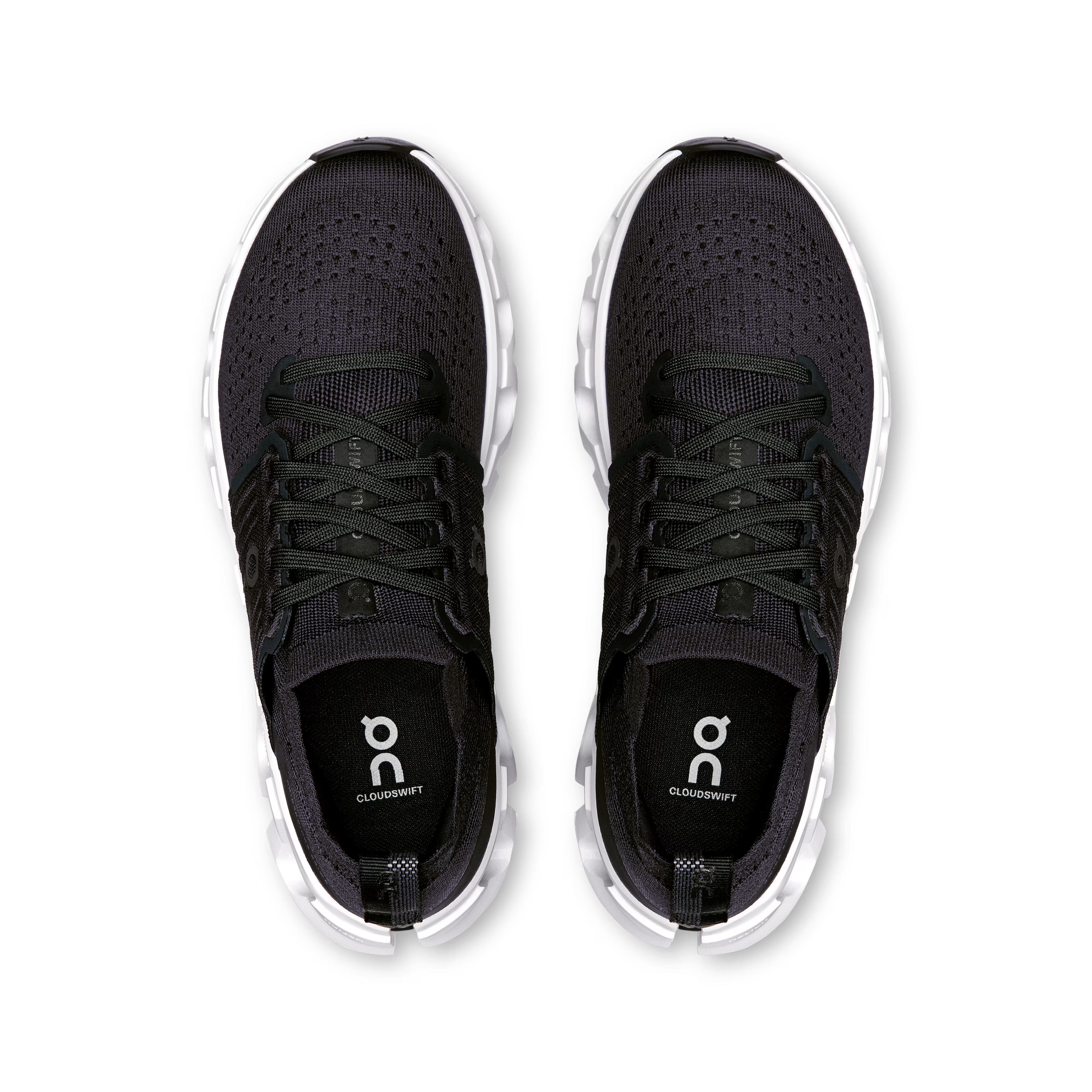 Black running shoes with white soles on a white background