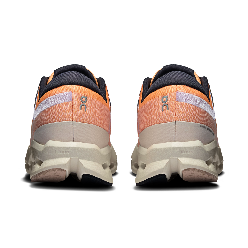 Pair of orange and black athletic shoes on a transparent background