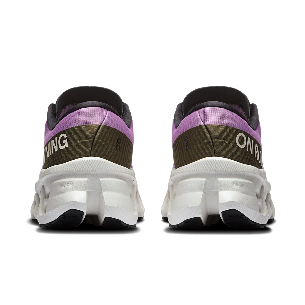 Pair of purple and black running shoes with white soles on a transparent background