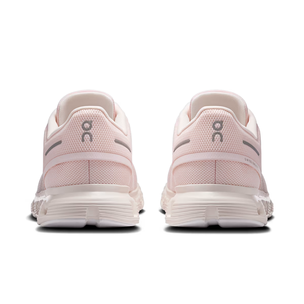 Pair of pink running shoes with white soles on a transparent background