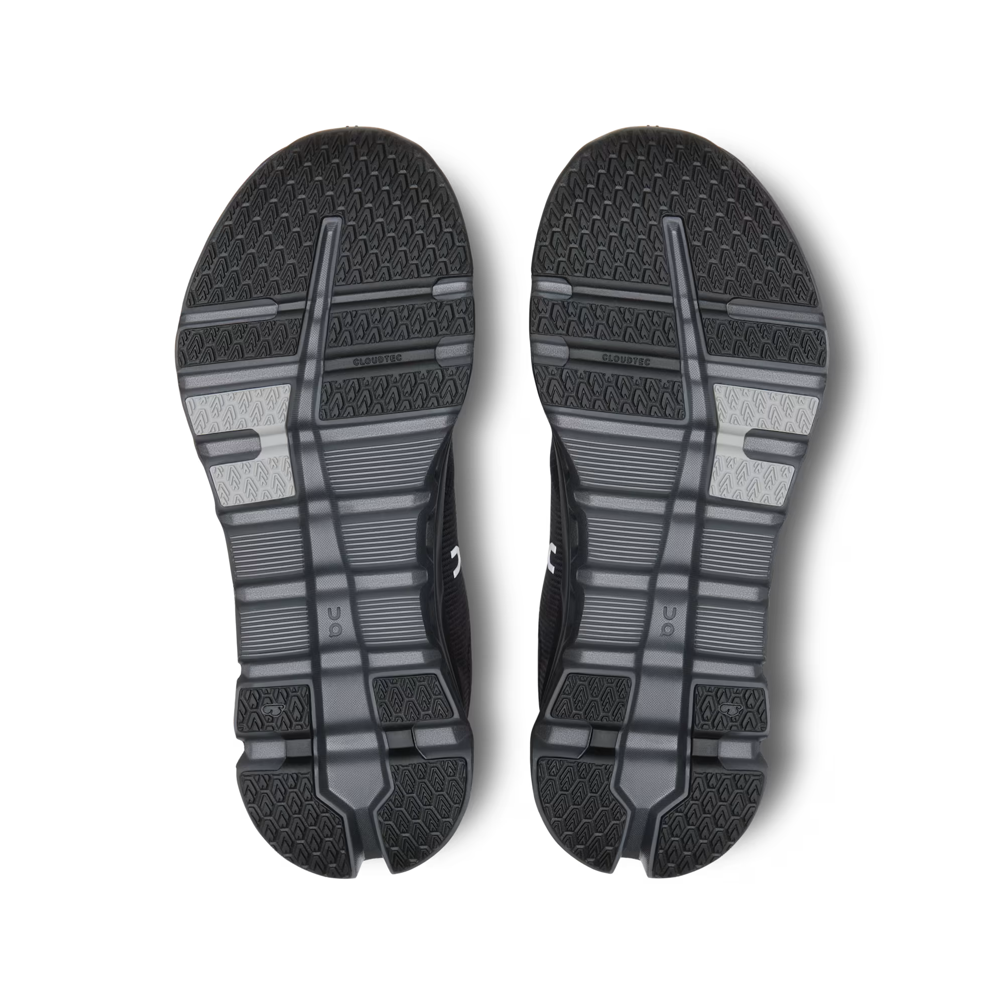 Black athletic shoe sole with tread pattern on a white background