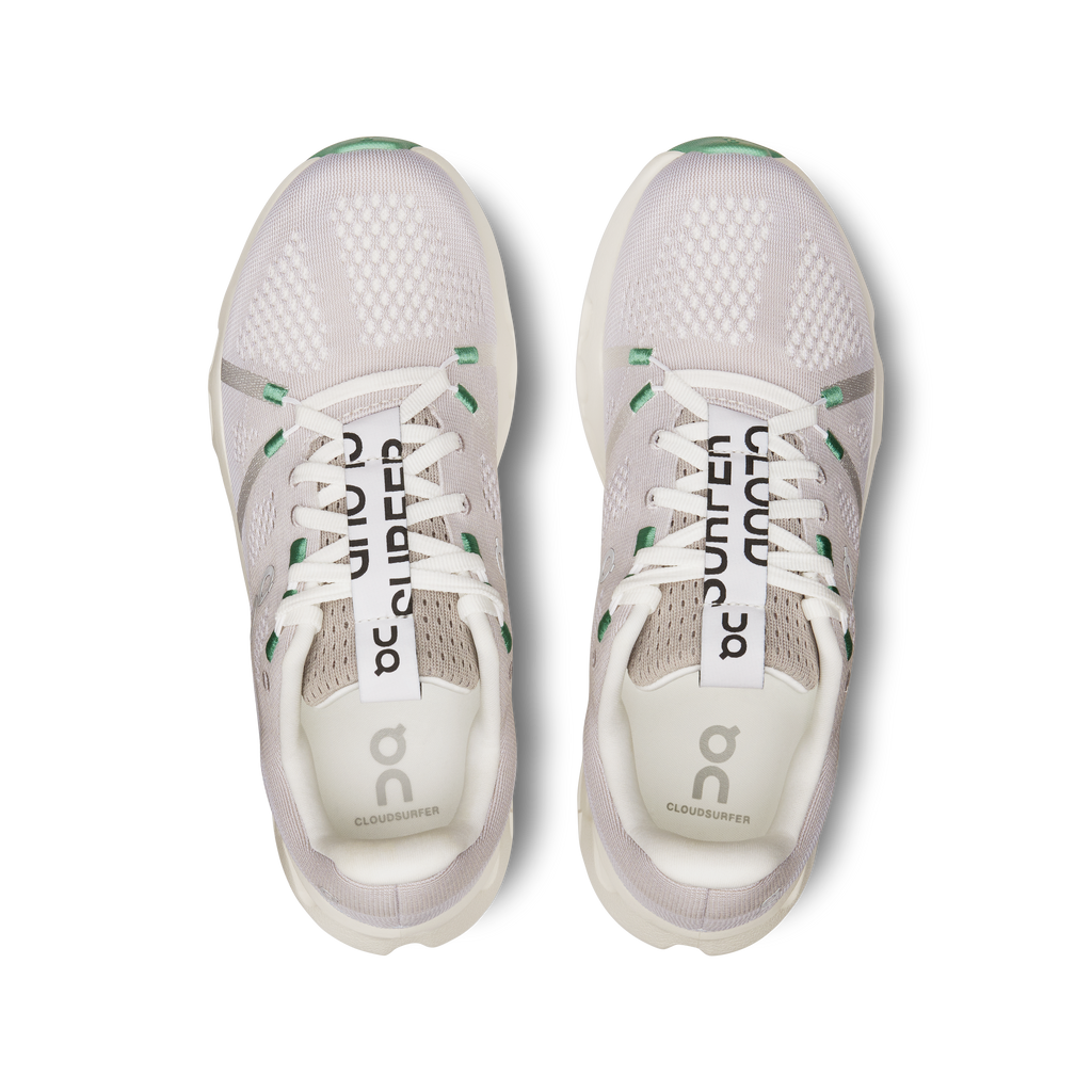 Pair of gray running shoes with white soles on a white background