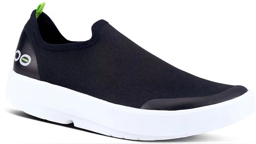 Navy blue casual shoe with a white sole on a white background