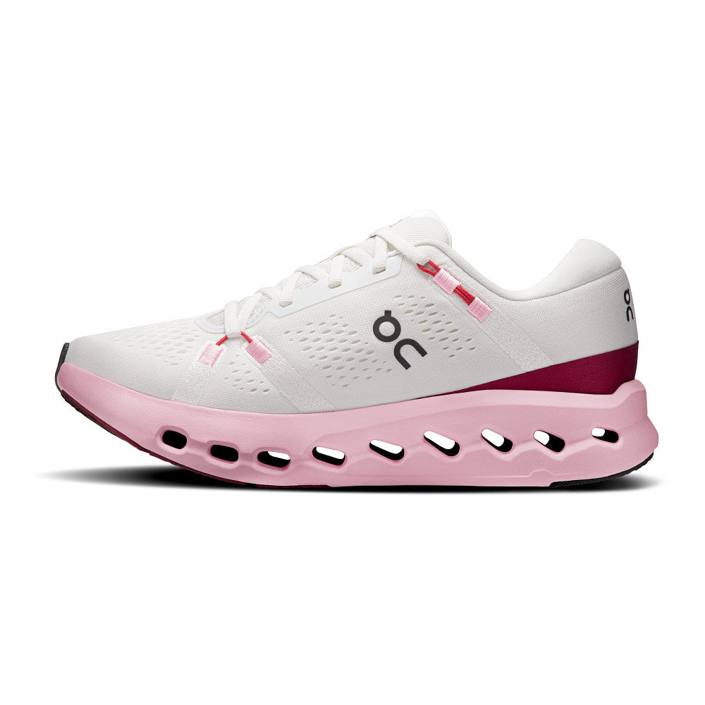 White and pink running shoe on a white background