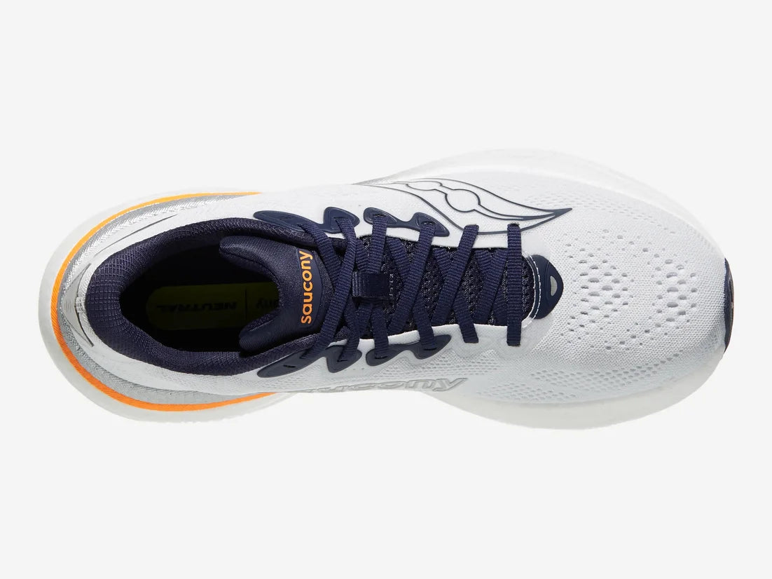 A top-down view of a Saucony athletic shoe in white, navy blue, and orange. The shoe features a white mesh upper, navy blue laces, a navy blue tongue with 'SAUCONY' printed in orange, and a thin orange accent line on the heel.