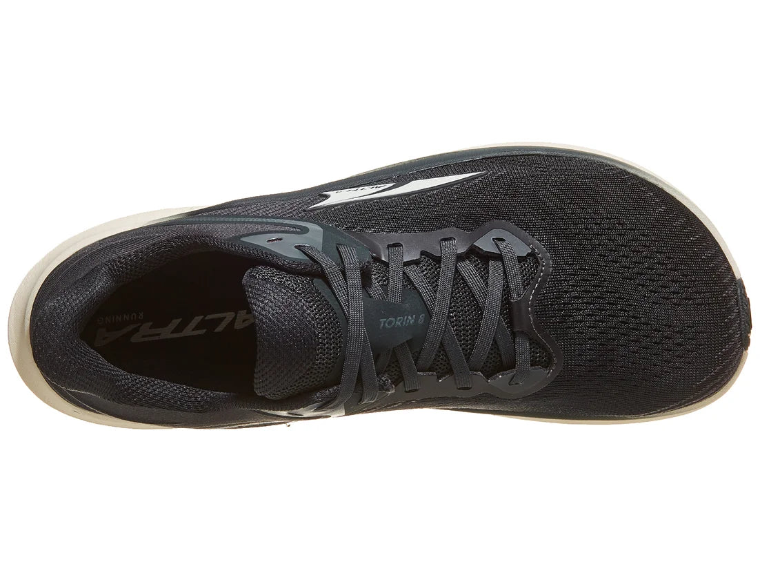 Black running shoe with visible branding on a white background