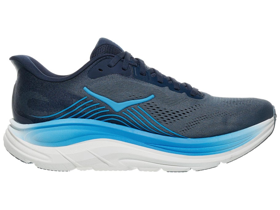 A single athletic running shoe shown in profile against a plain white background. The upper is primarily dark navy blue with a textured knit pattern, accented by bright blue wave-like lines and a blue logo, while the midsole is white with a translucent blue section.