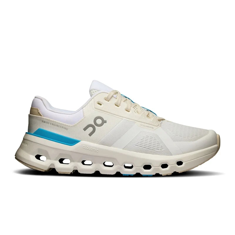 A single On Cloudrunning shoe in off-white and beige with a bright blue accent stripe and matching blue laces, shown in a side profile on a white background.