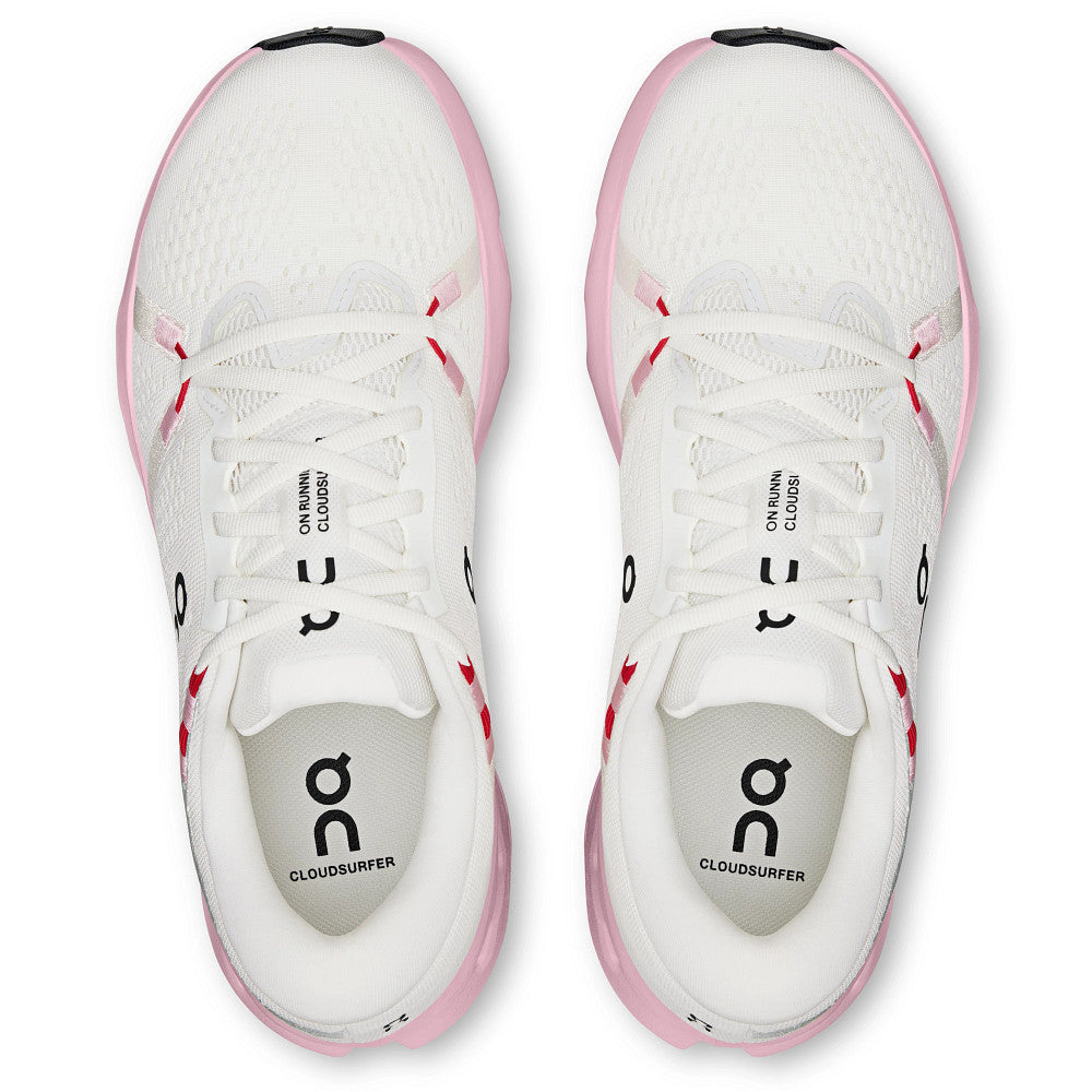 White and pink running shoes with 'On' branding on a white background