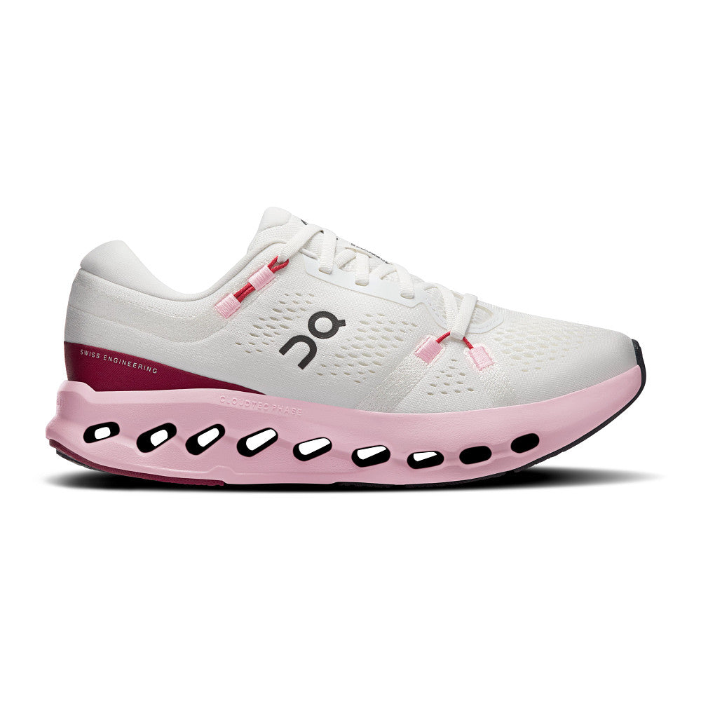White and pink running shoe with visible brand logo on a white background